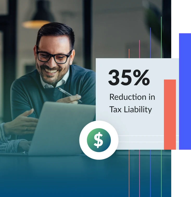 A man smiling while reviewing his tax report during a meeting. An overlay message says 35 percent reduction in tax liability.